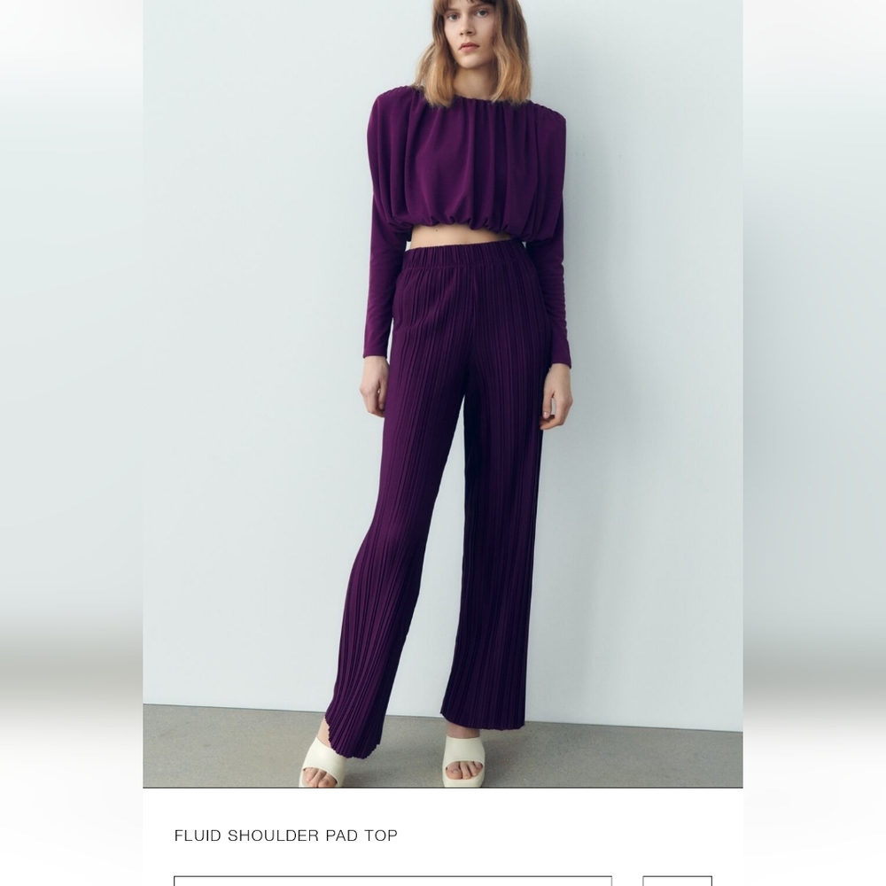 Fluid shoulder pad top